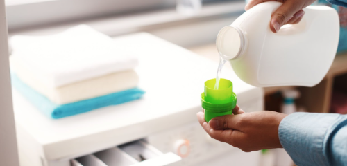 Pouring laundry liquid detergent