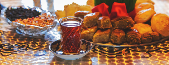 Arranging the hospitality tray with tea and sweets