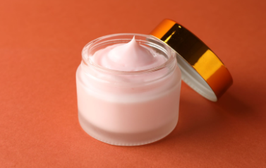 Applying body moisturizer cream