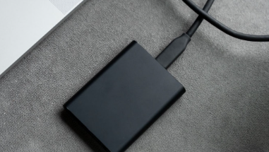 Power bank connected to a laptop for charging