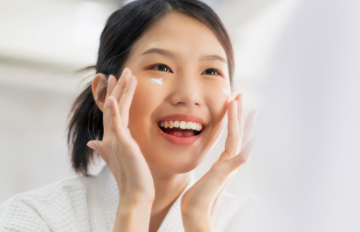 A girl applying her daily skincare routine