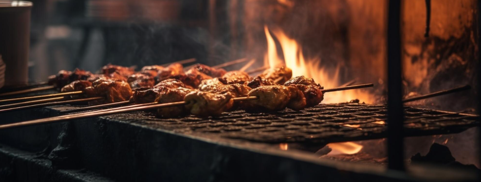 Delicious meat cuts on a glowing charcoal grill
